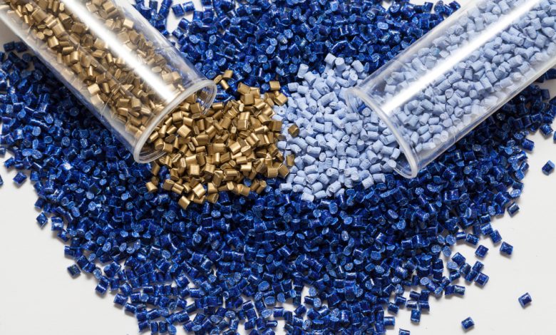 plastic granules, blue and gold close up